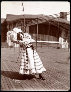 An actress in costume rehearsing on the roof of what is probably the New York Theatre, New York, 1900